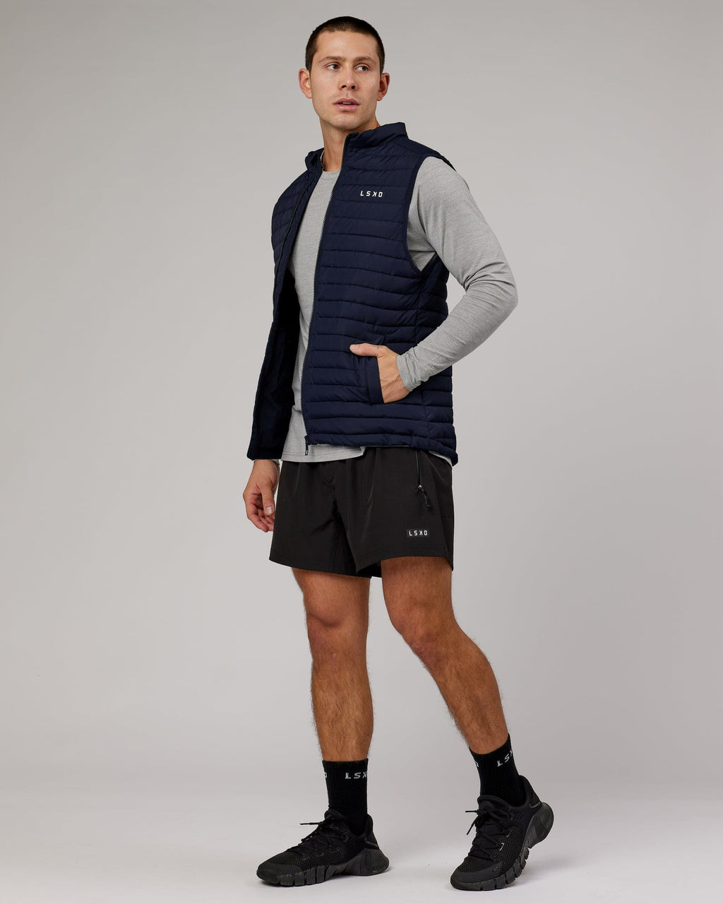 Model wearing Uplift Puffer Vest - Navy
