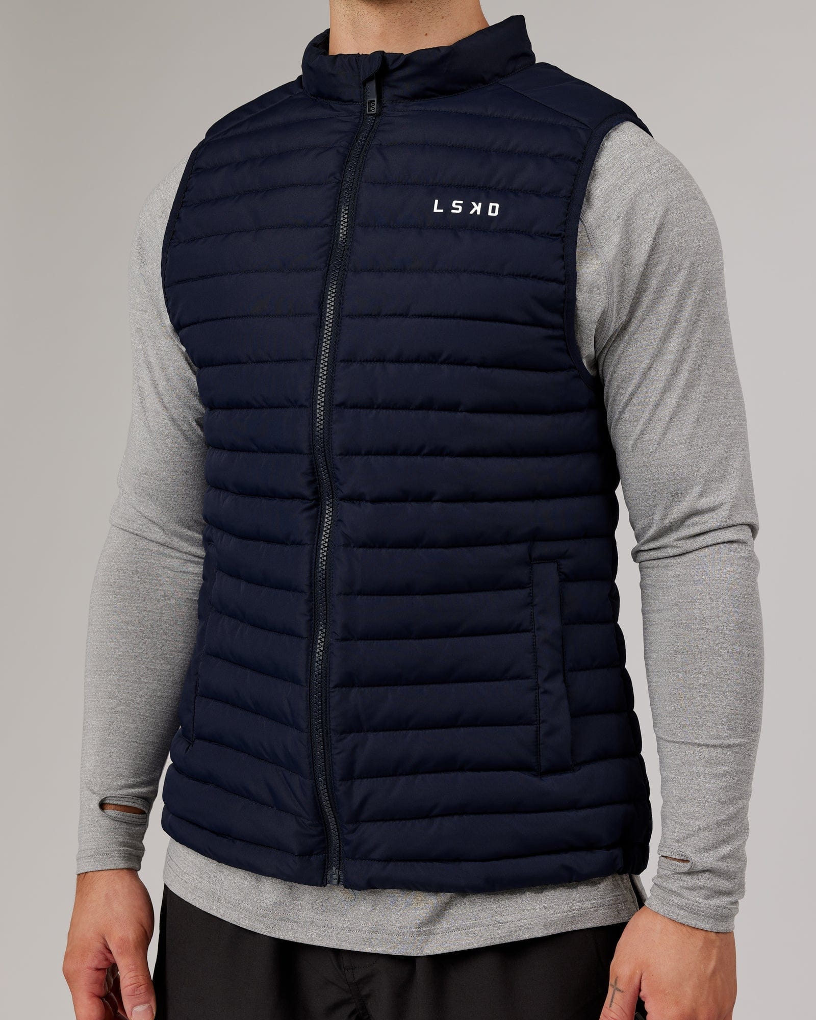 Model wearing Uplift Puffer Vest - Navy