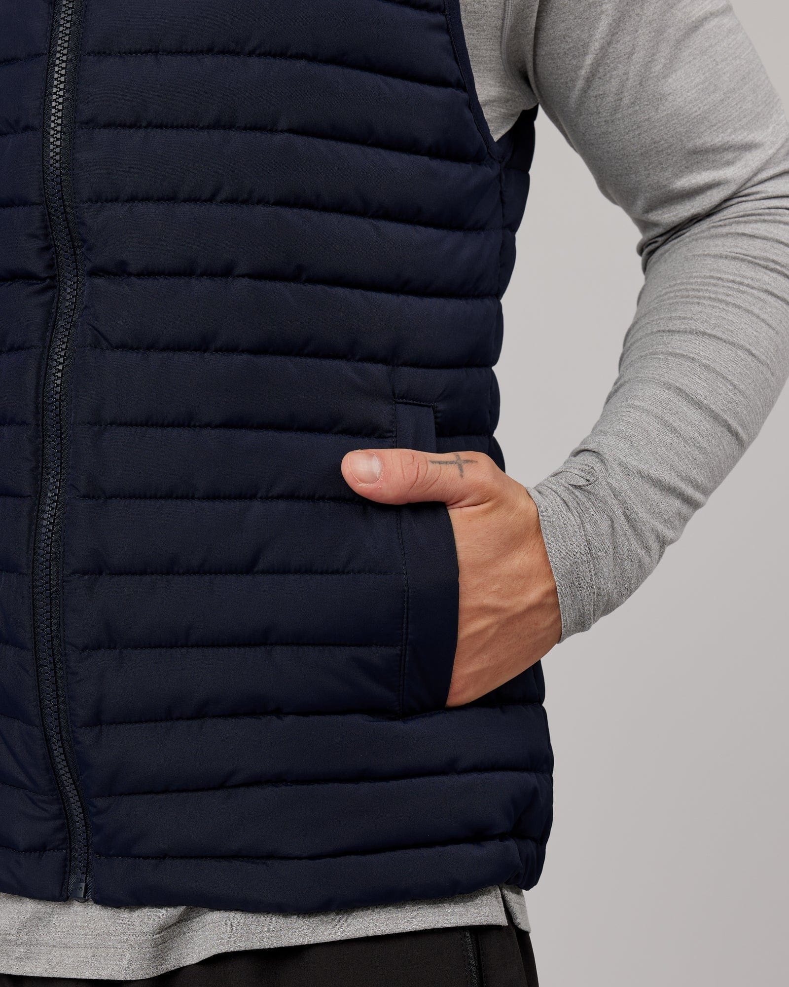 Model wearing Uplift Puffer Vest - Navy