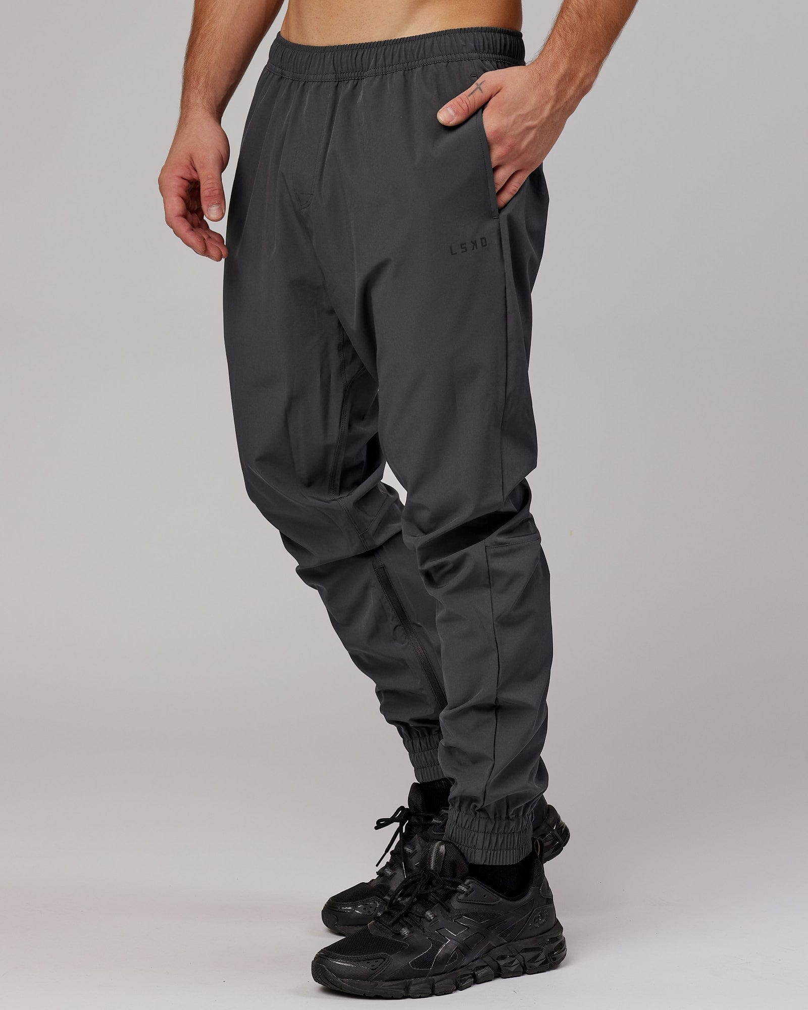 Model wearing Warm Up Zip Cuff Performance Jogger - Asphalt
