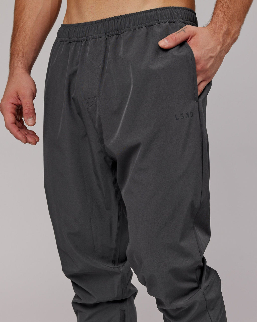Model wearing Warm Up Zip Cuff Performance Jogger - Asphalt