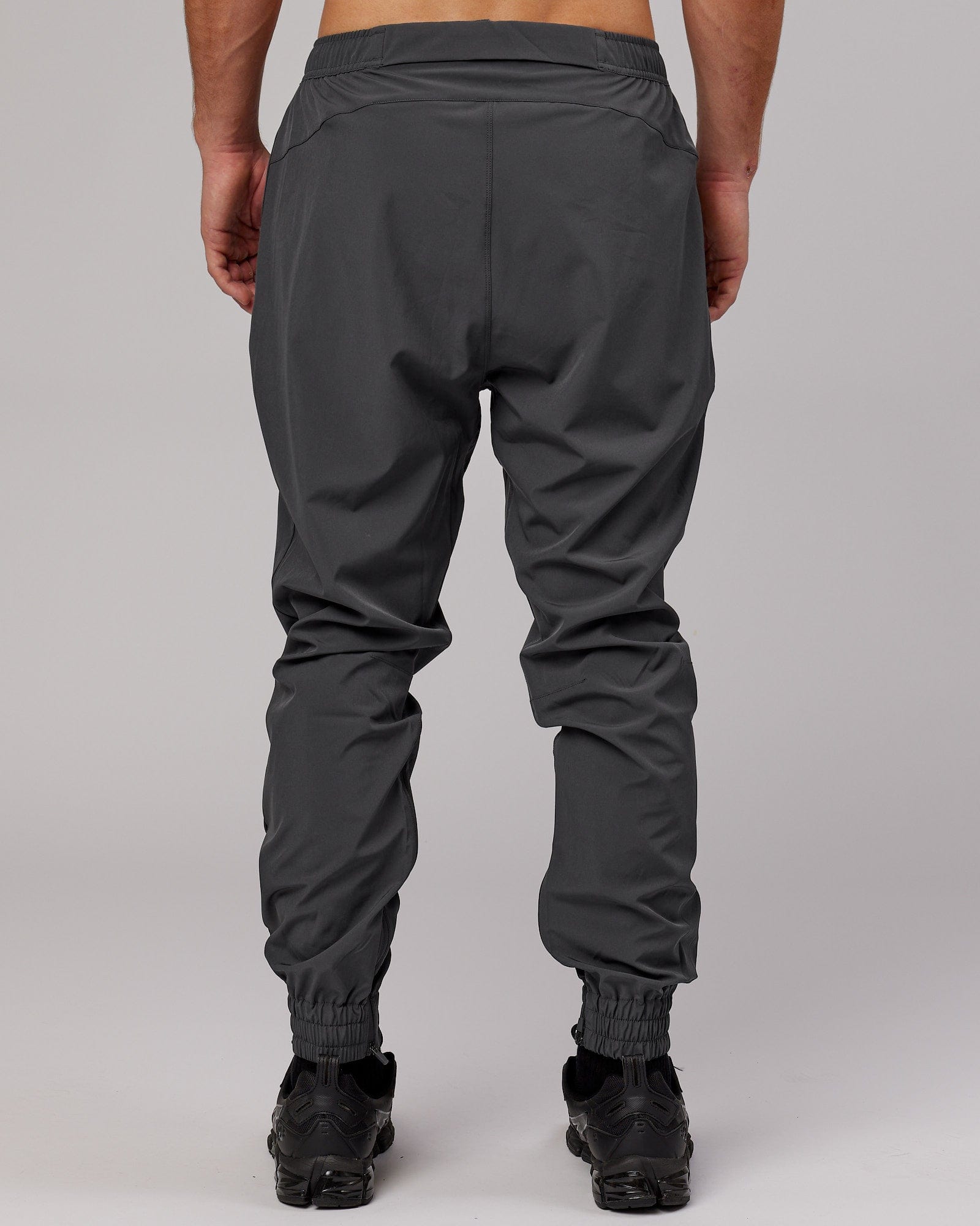 Model wearing Warm Up Zip Cuff Performance Jogger - Asphalt