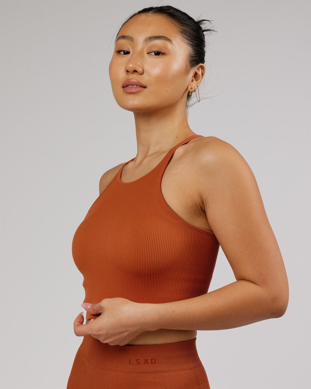 Model wearing Minimal Seamless Crop Ribbed Tank - Auburn