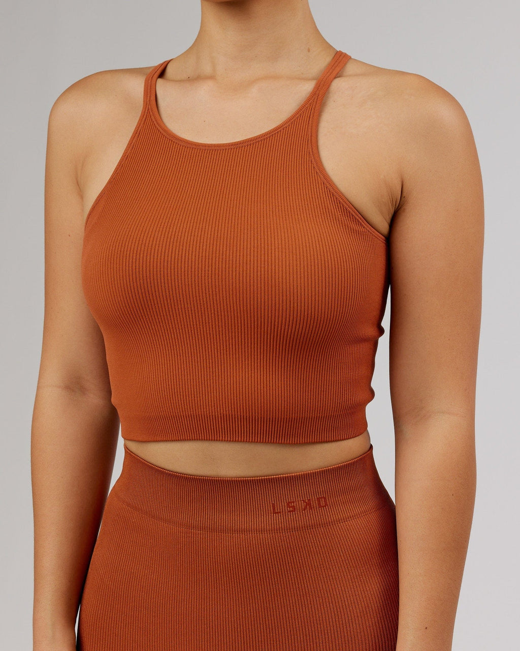 Model wearing Minimal Seamless Crop Ribbed Tank - Auburn
