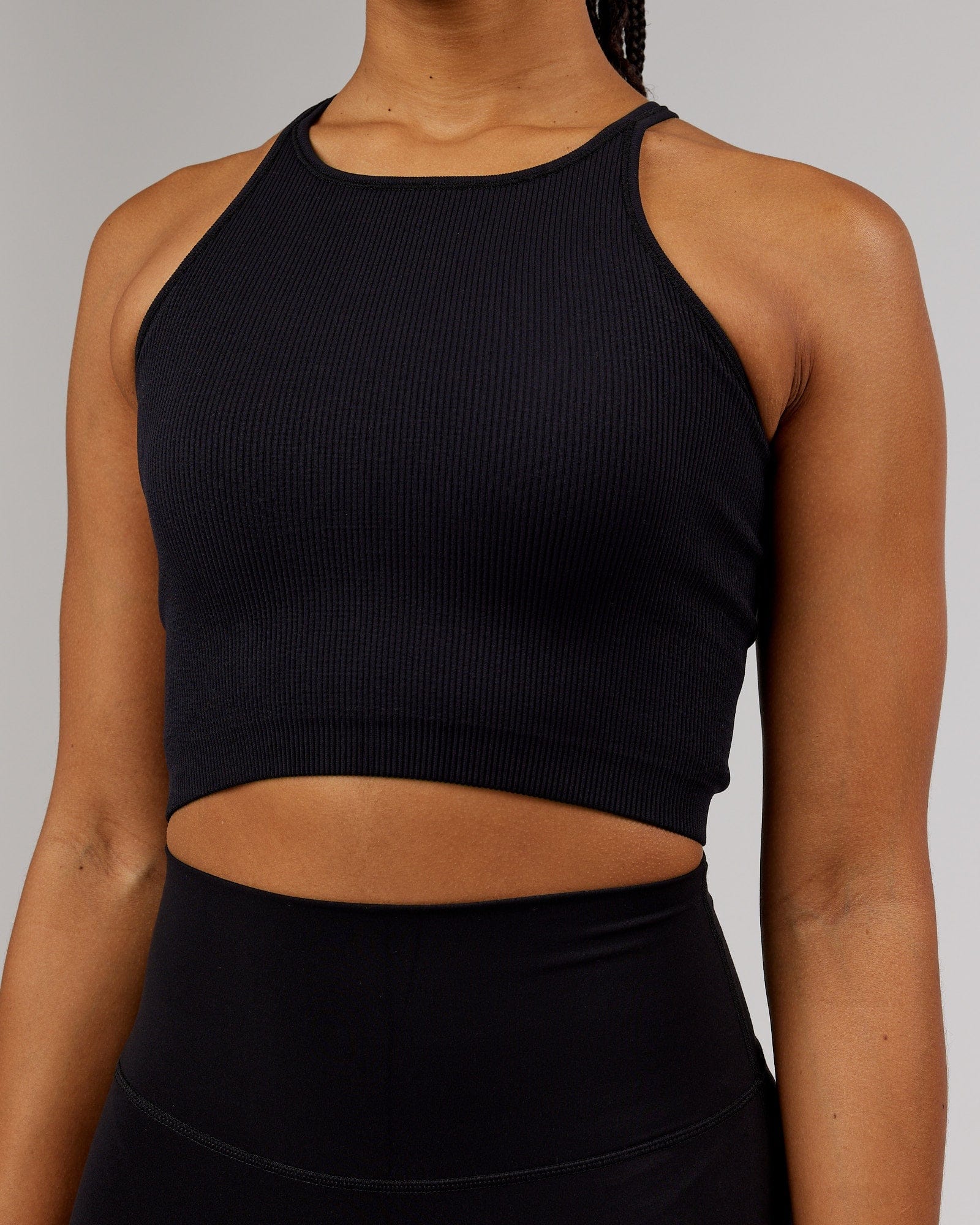 Model wearing Minimal Seamless Crop Ribbed Tank - Black