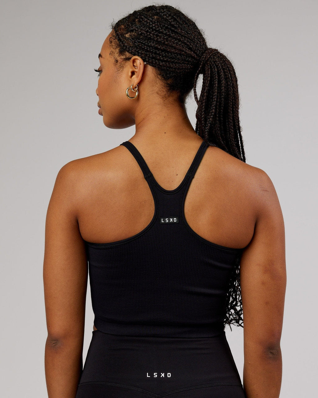 Model wearing Minimal Seamless Crop Ribbed Tank - Black