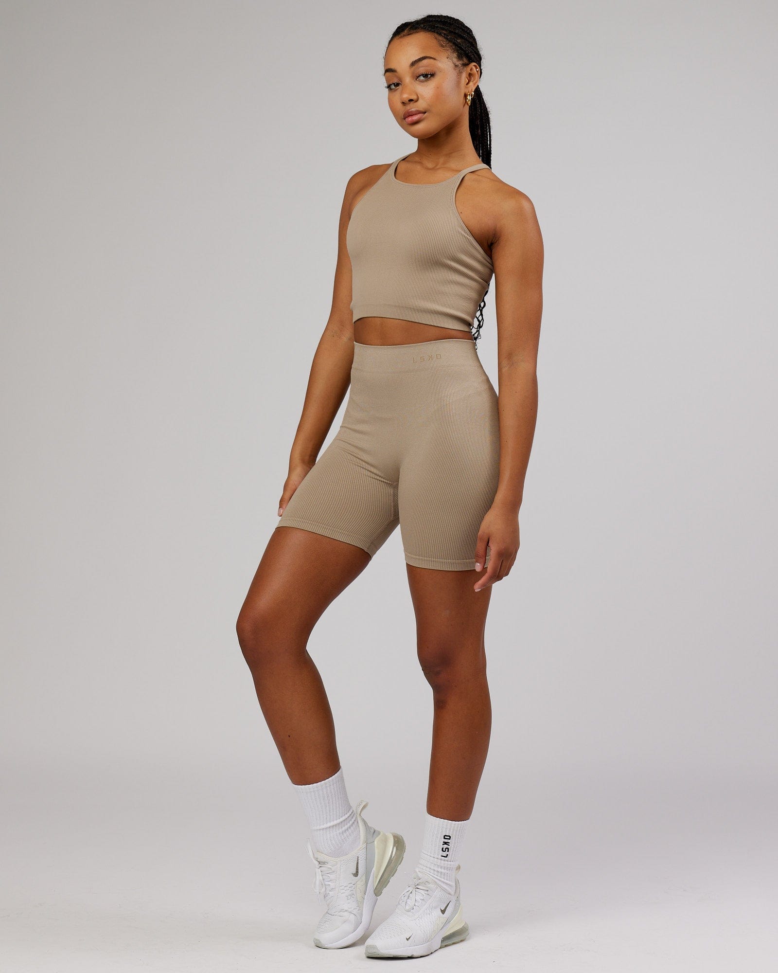 Model wearing Minimal Seamless Crop Ribbed Tank - Taupe