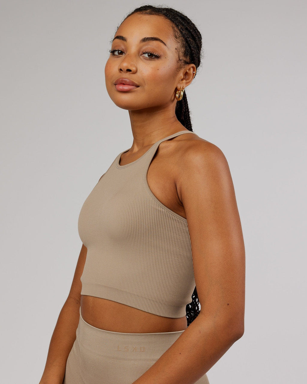 Model wearing Minimal Seamless Crop Ribbed Tank - Taupe