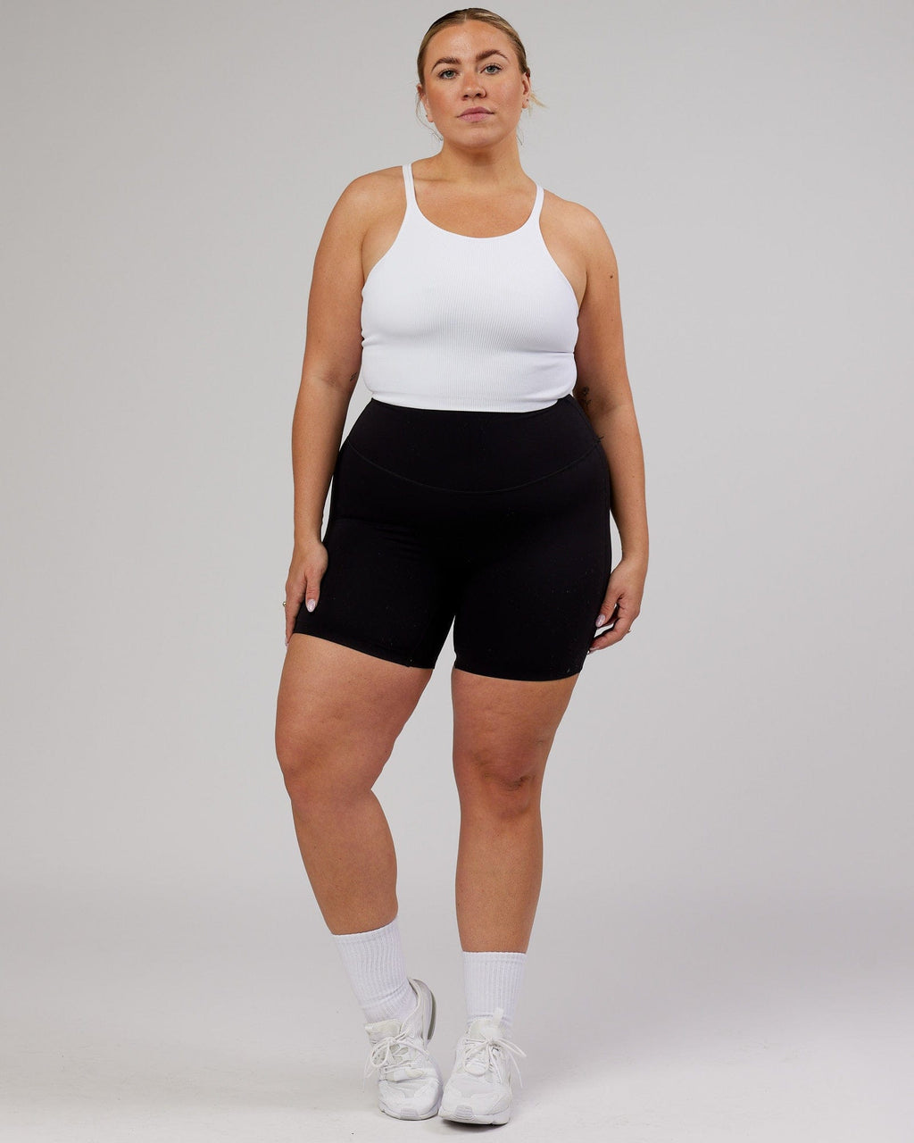 Model wearing Minimal Seamless Crop Ribbed Tank - White