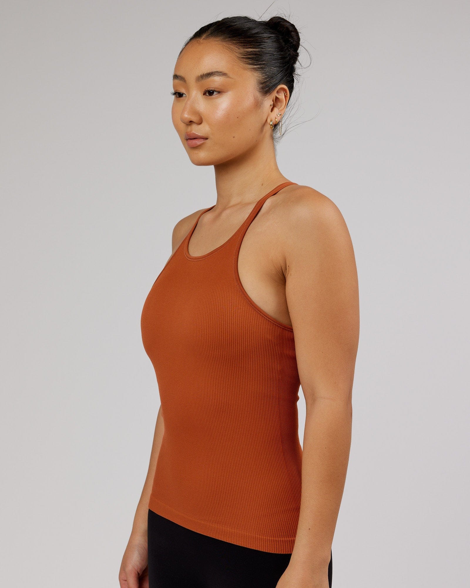 Model wearing Minimal Seamless Ribbed Tank - Auburn