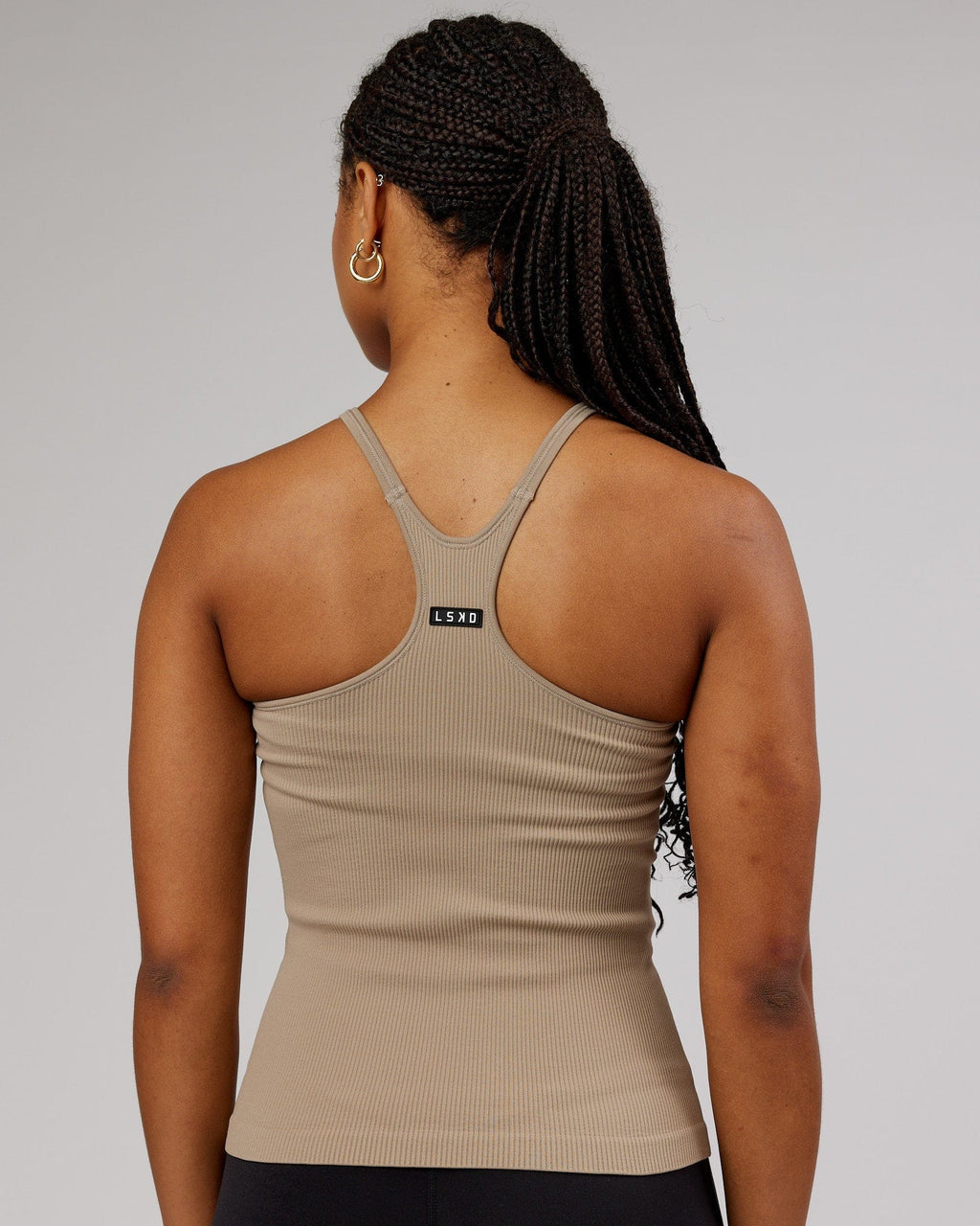 Model wearing Minimal Seamless Ribbed Tank - Taupe