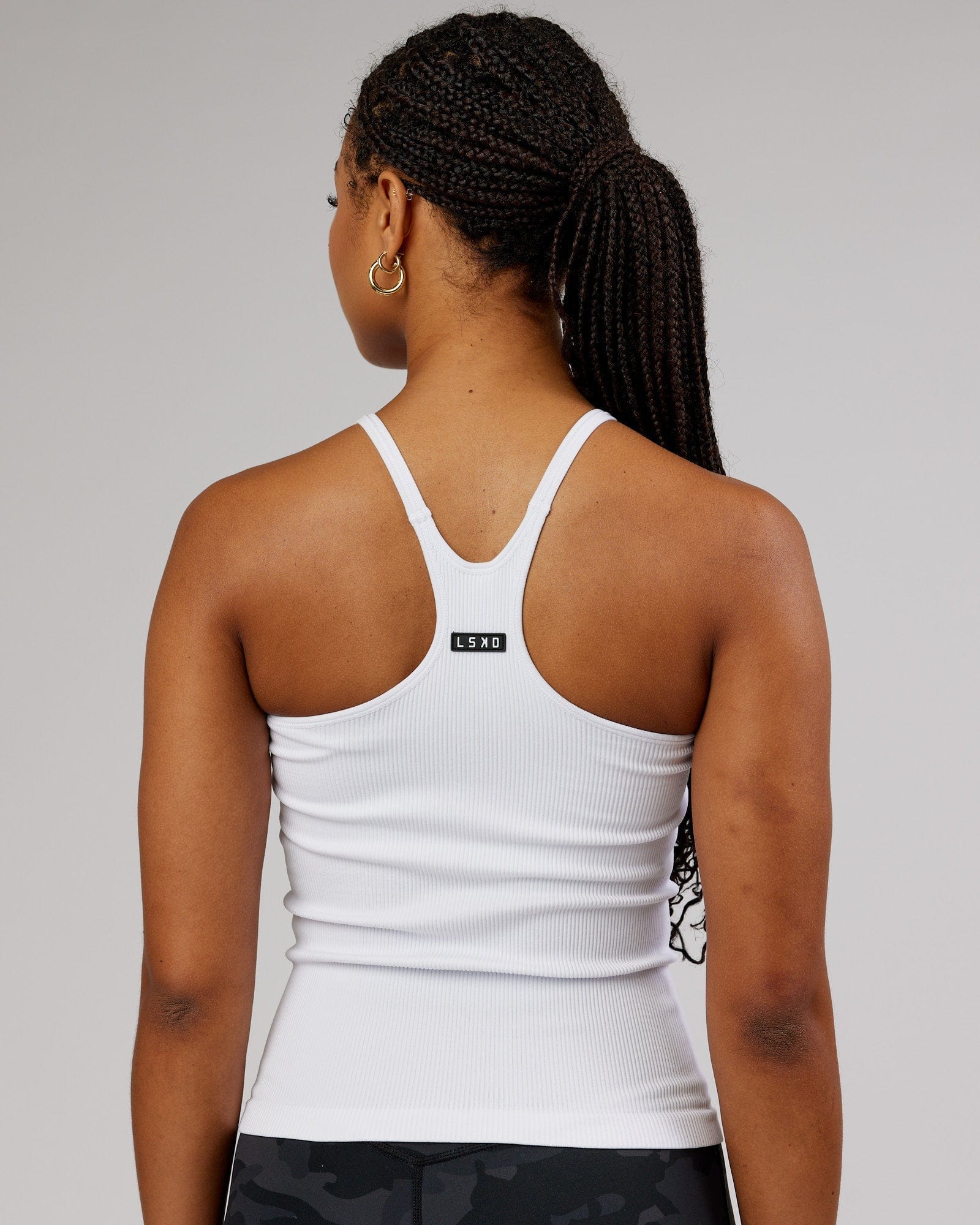 Model wearing Minimal Seamless Ribbed Tank - White