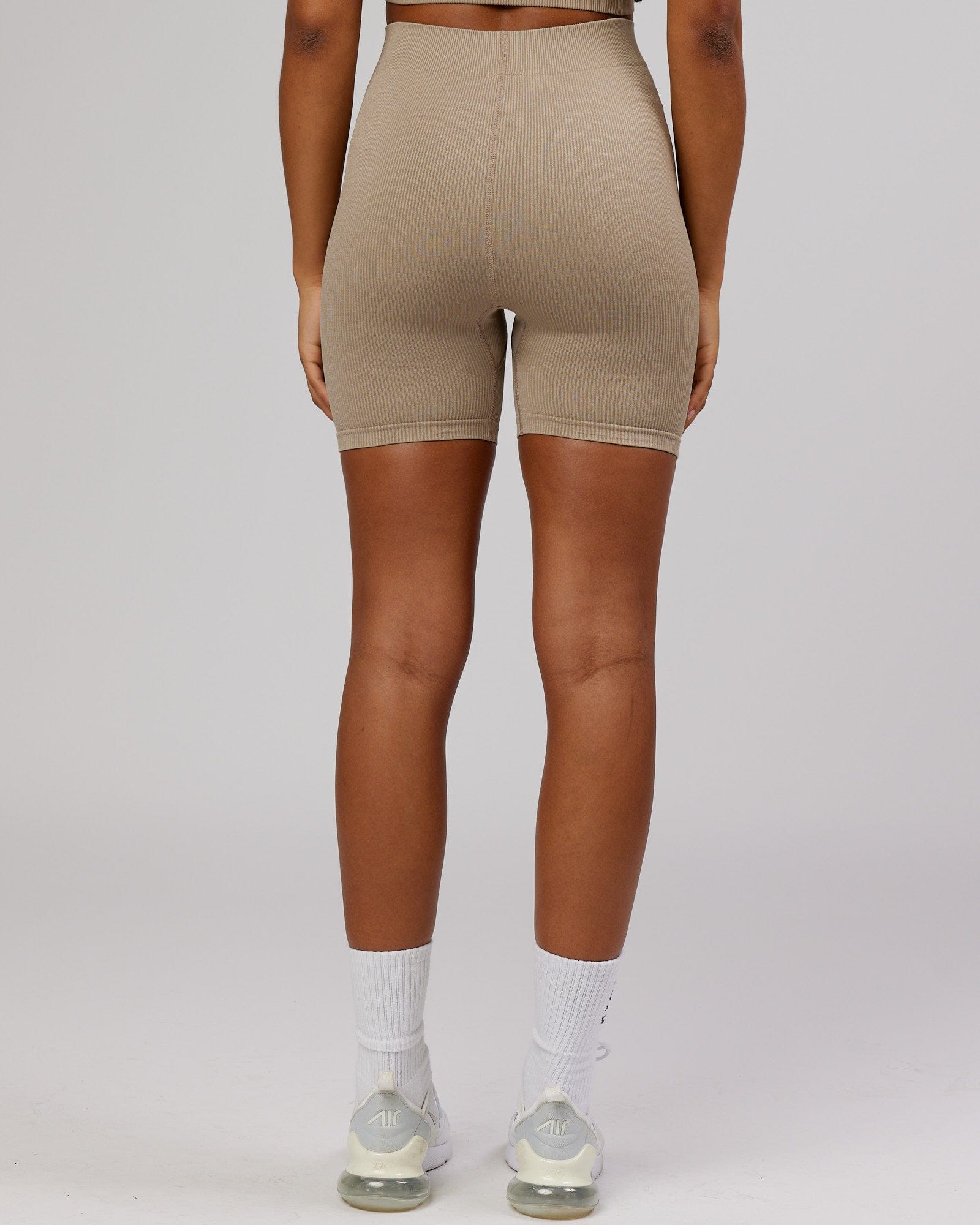 Model wearing Minimal Ribbed Seamless Shorts - Taupe