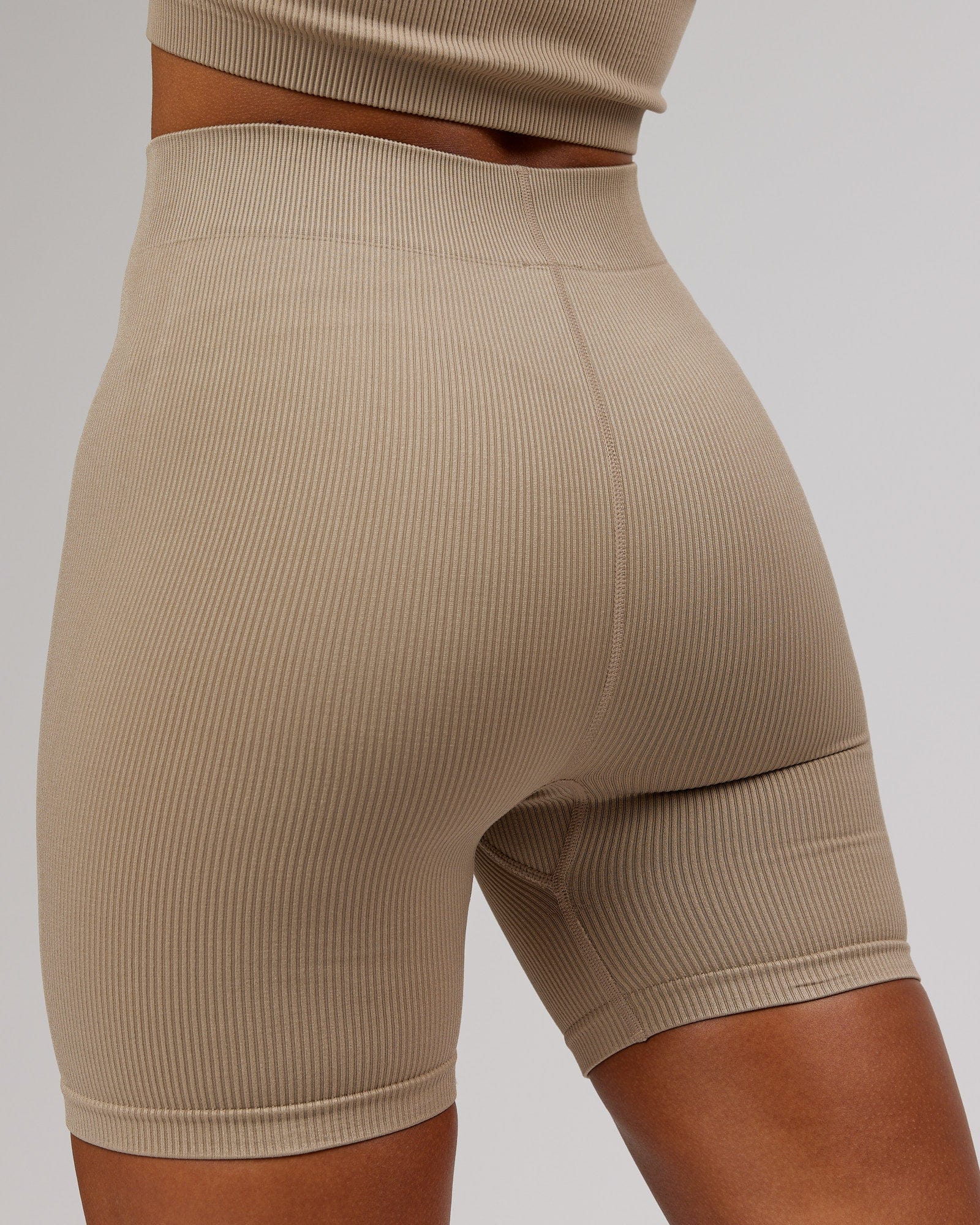 Model wearing Minimal Ribbed Seamless Shorts - Taupe