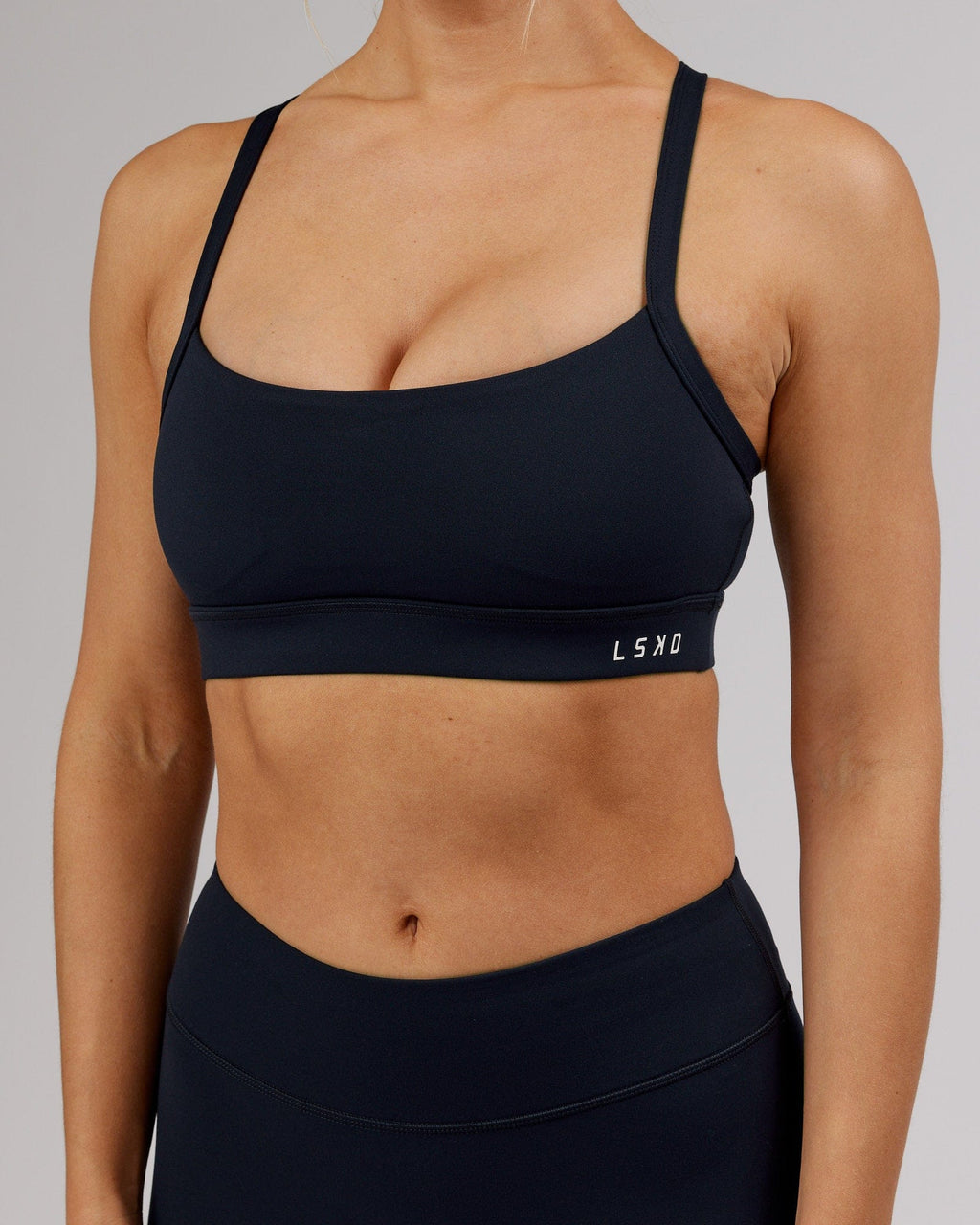 Model wearing Momentum Sports Bra - Navy
