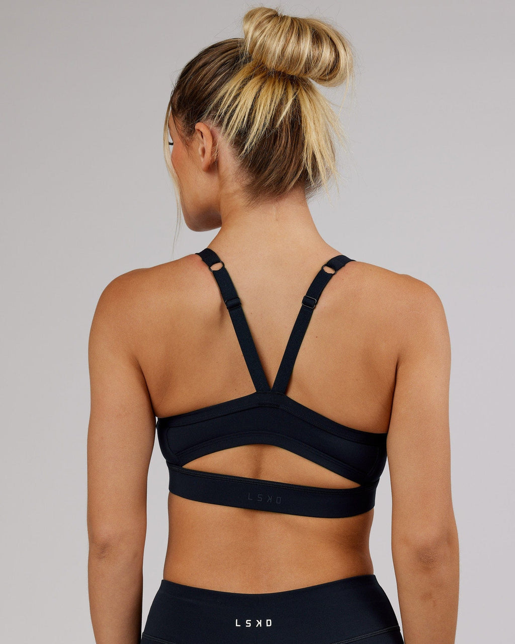 Model wearing Momentum Sports Bra - Navy