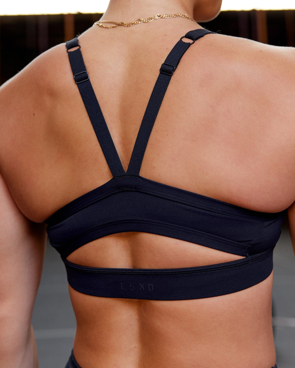 Model wearing Momentum Sports Bra - Navy