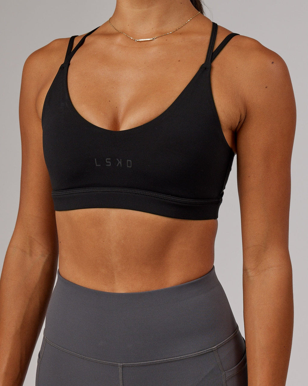 Model wearing Movement Sports Bra - Black