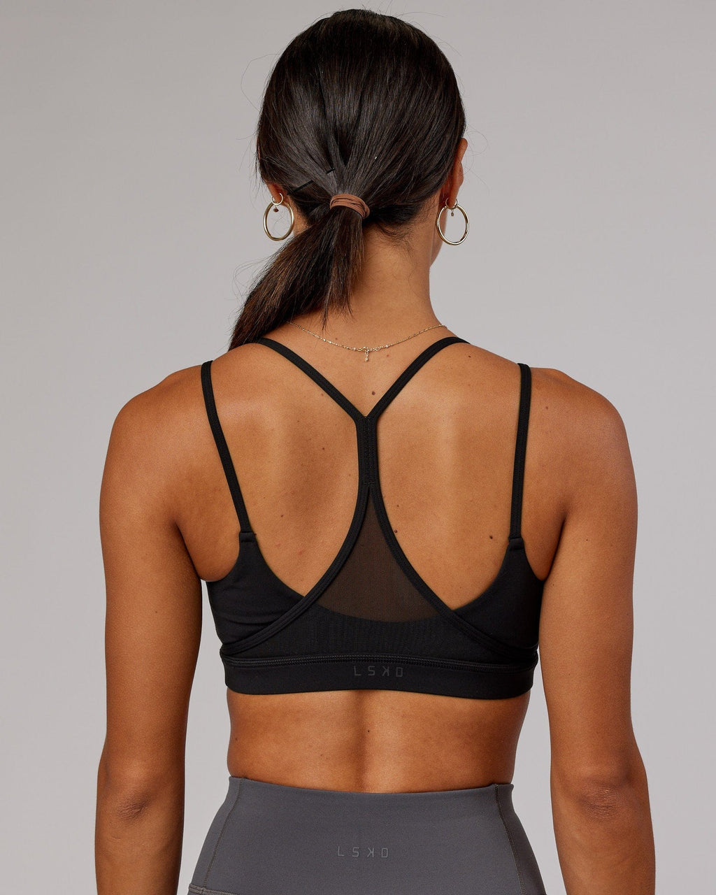 Model wearing Movement Sports Bra - Black