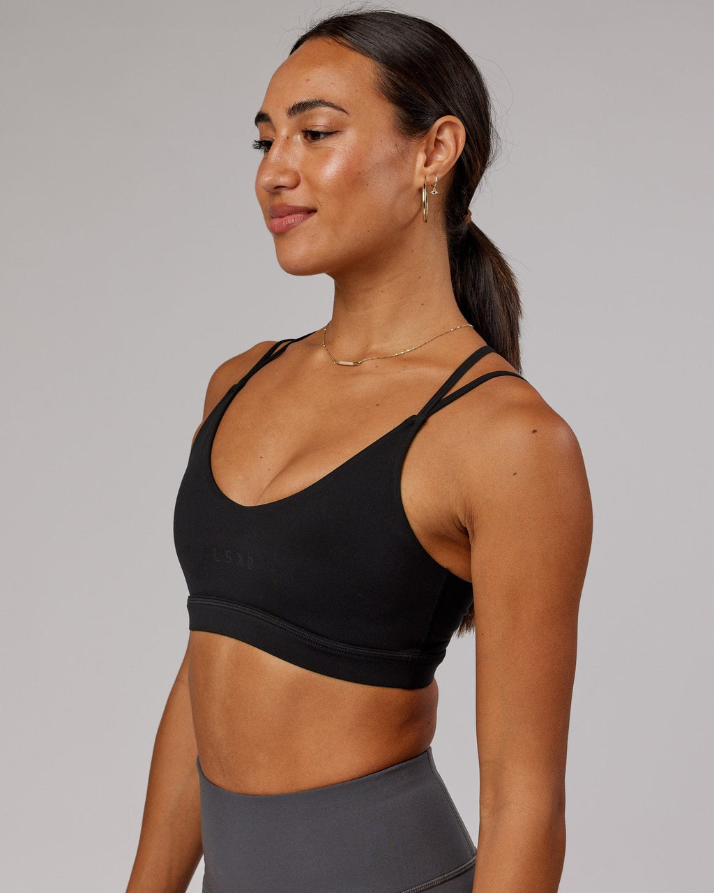 Model wearing Movement Sports Bra - Black