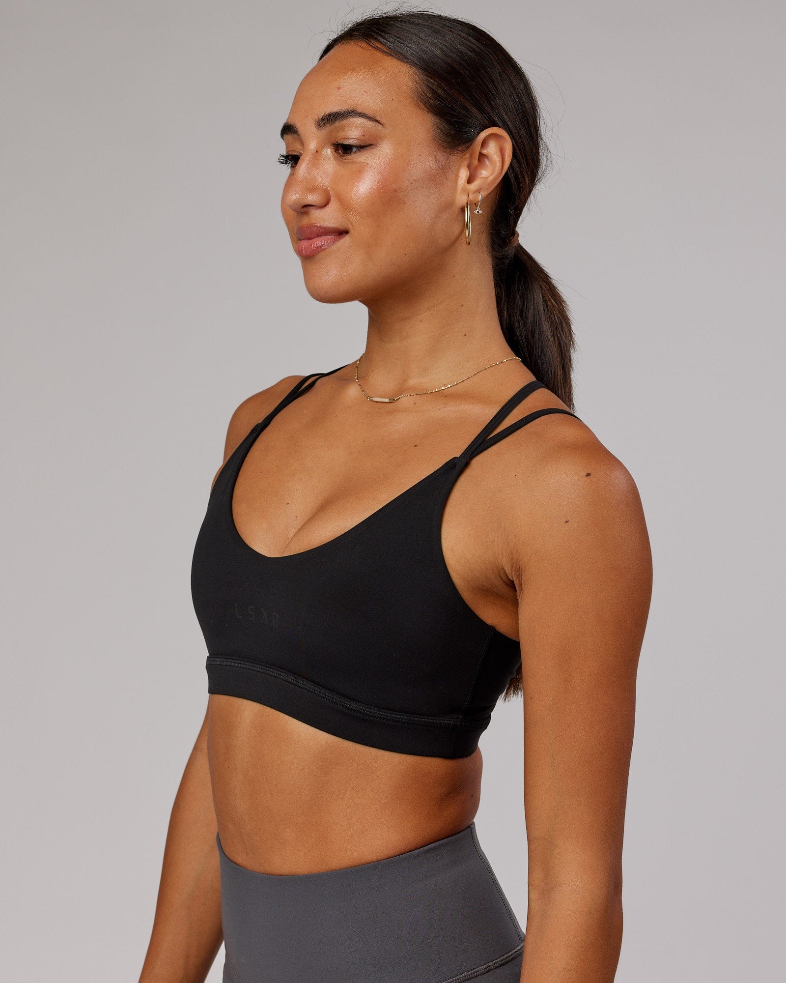 Model wearing Movement Sports Bra - Black
