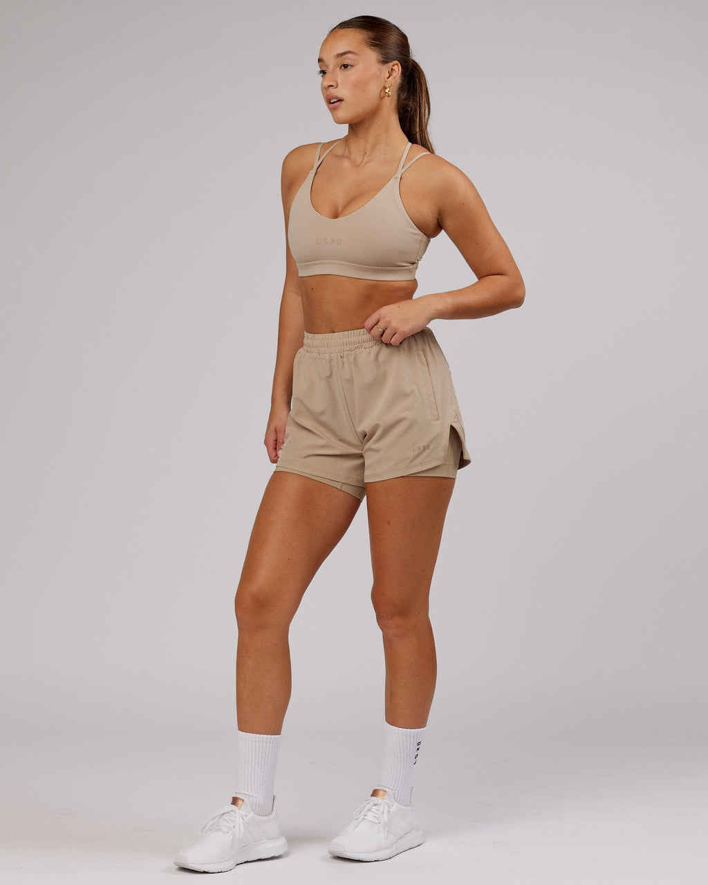 Model wearing Movement Sports Bra - Taupe