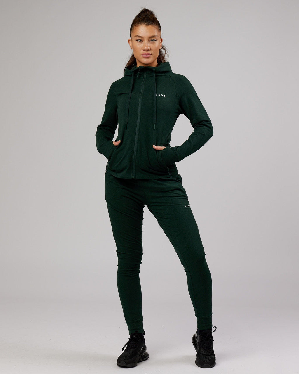 Model wearing PB Zip Through Hoodie - Forest-Tonal