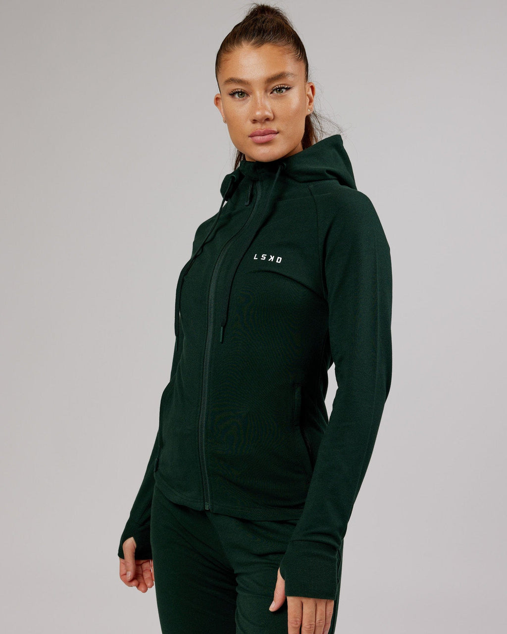 Model wearing PB Zip Through Hoodie - Forest-Tonal