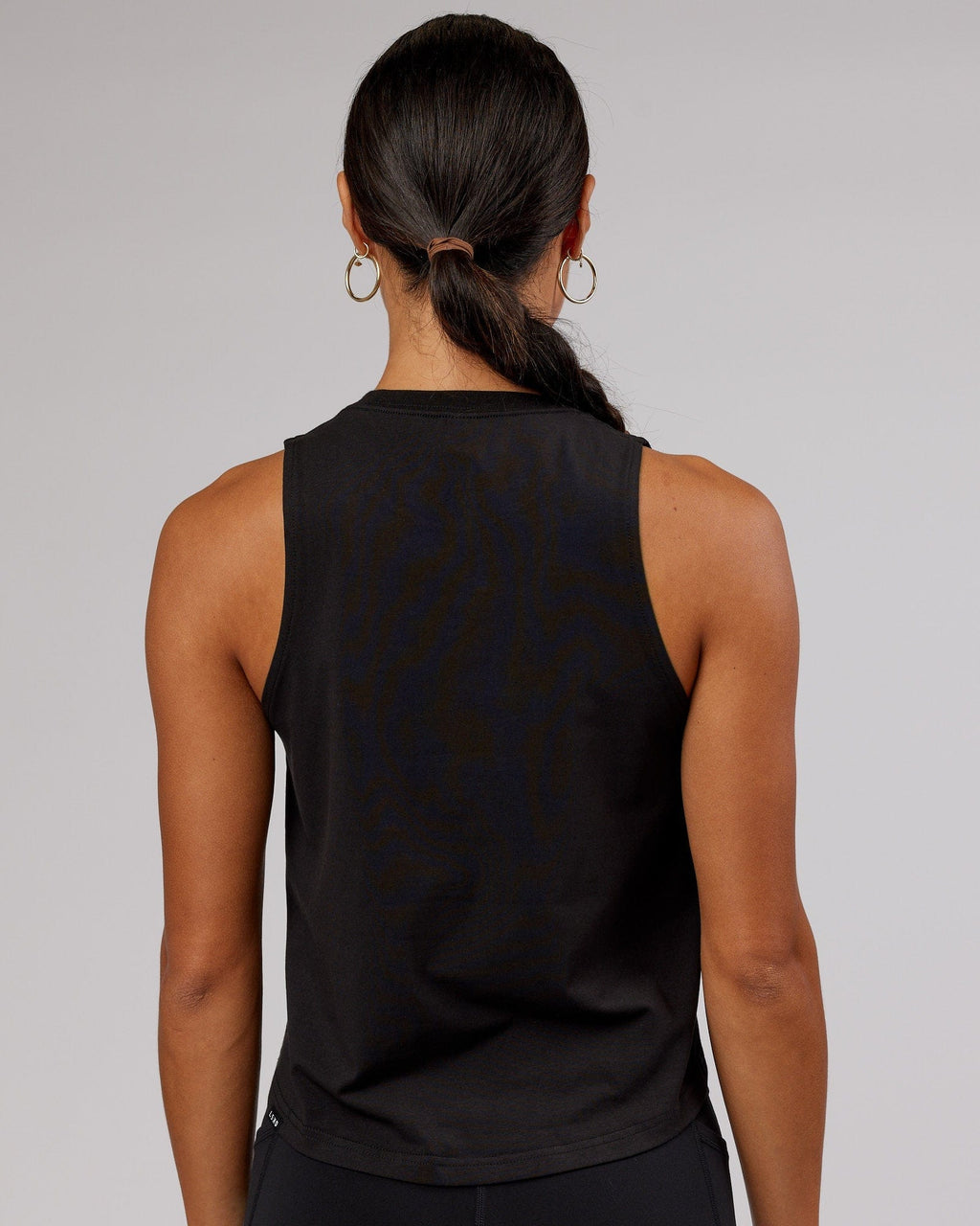 Model wearing Penalty Tank - Black-Hyper Teal