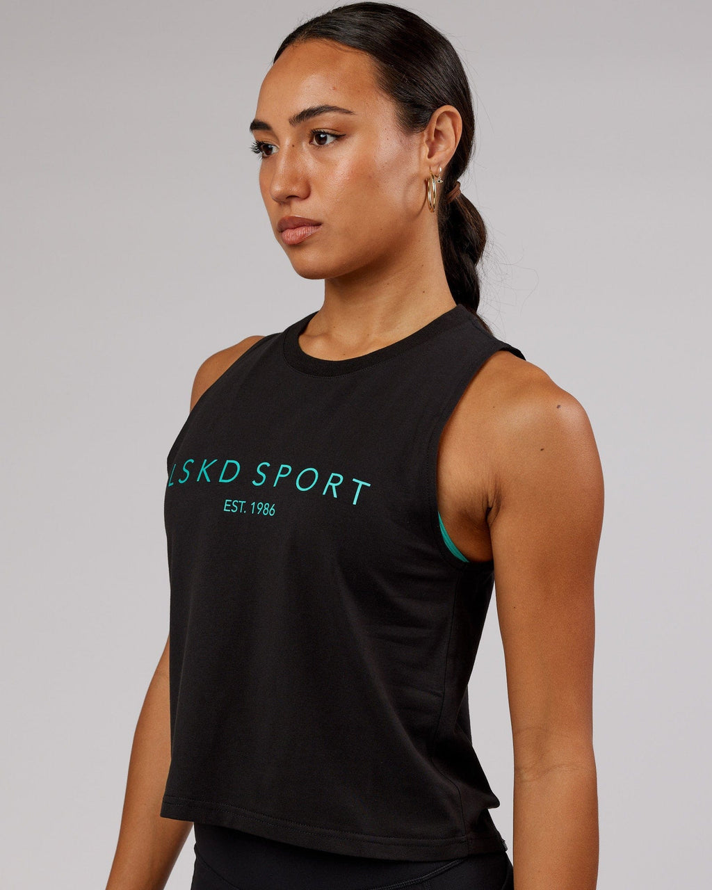 Model wearing Penalty Tank - Black-Hyper Teal
