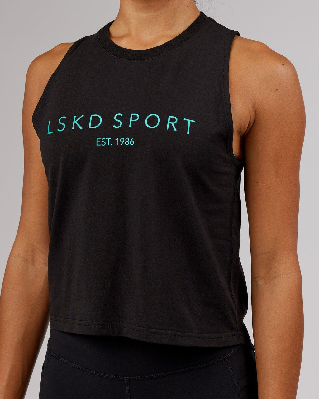 Model wearing Penalty Tank - Black-Hyper Teal
