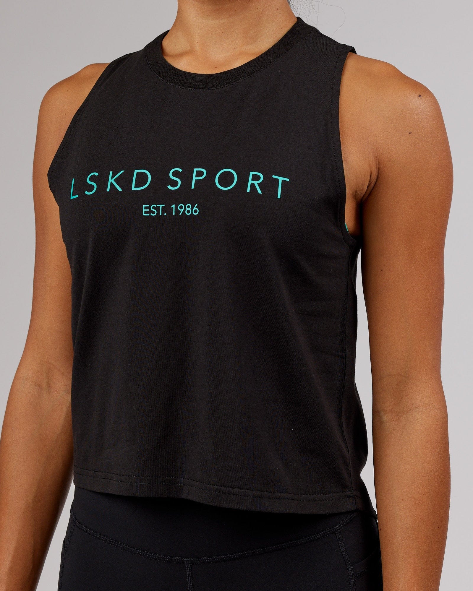 Model wearing Penalty Tank - Black-Hyper Teal