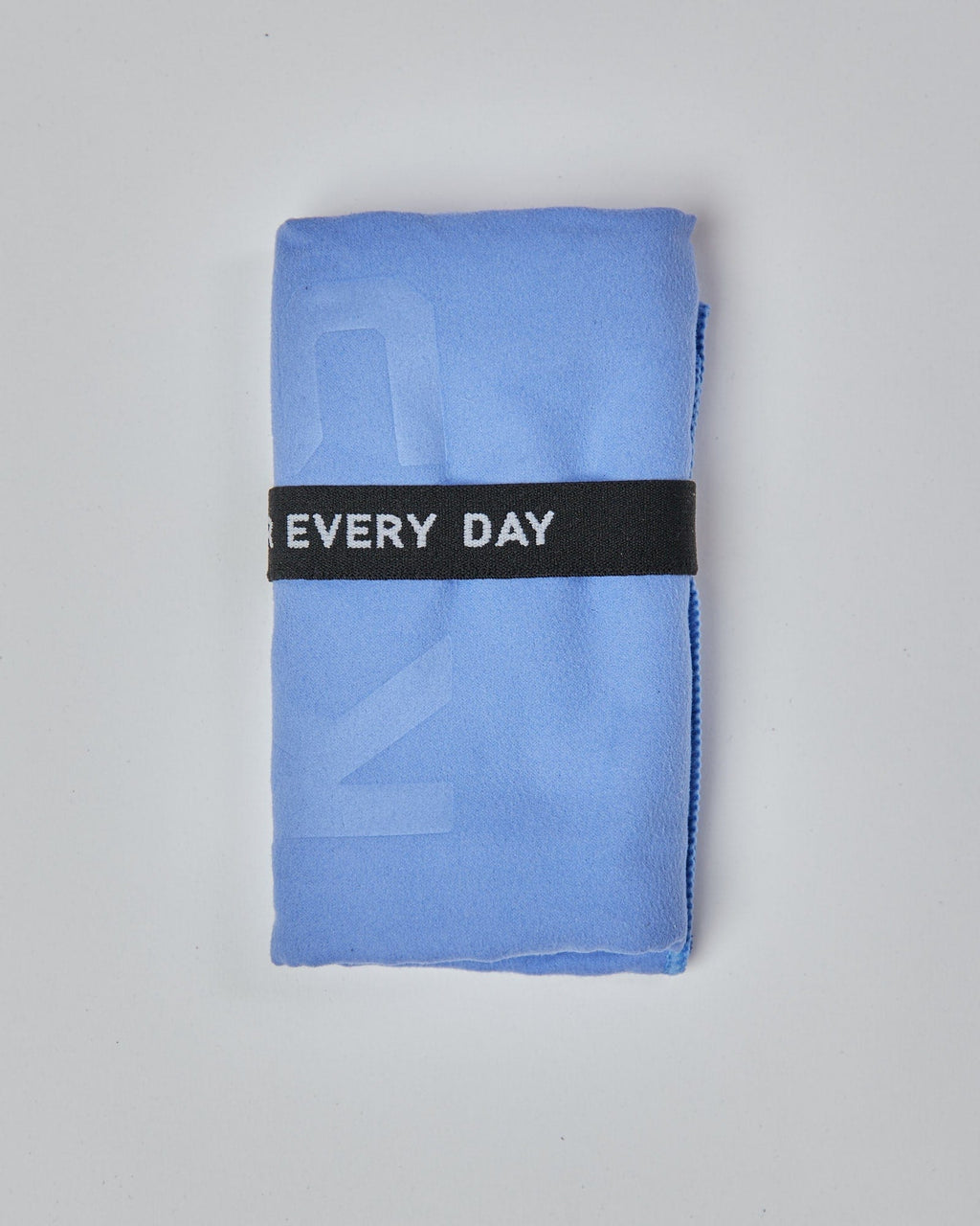 Model wearing Perform Lightweight Microfibre Towel - Cornflower Blue