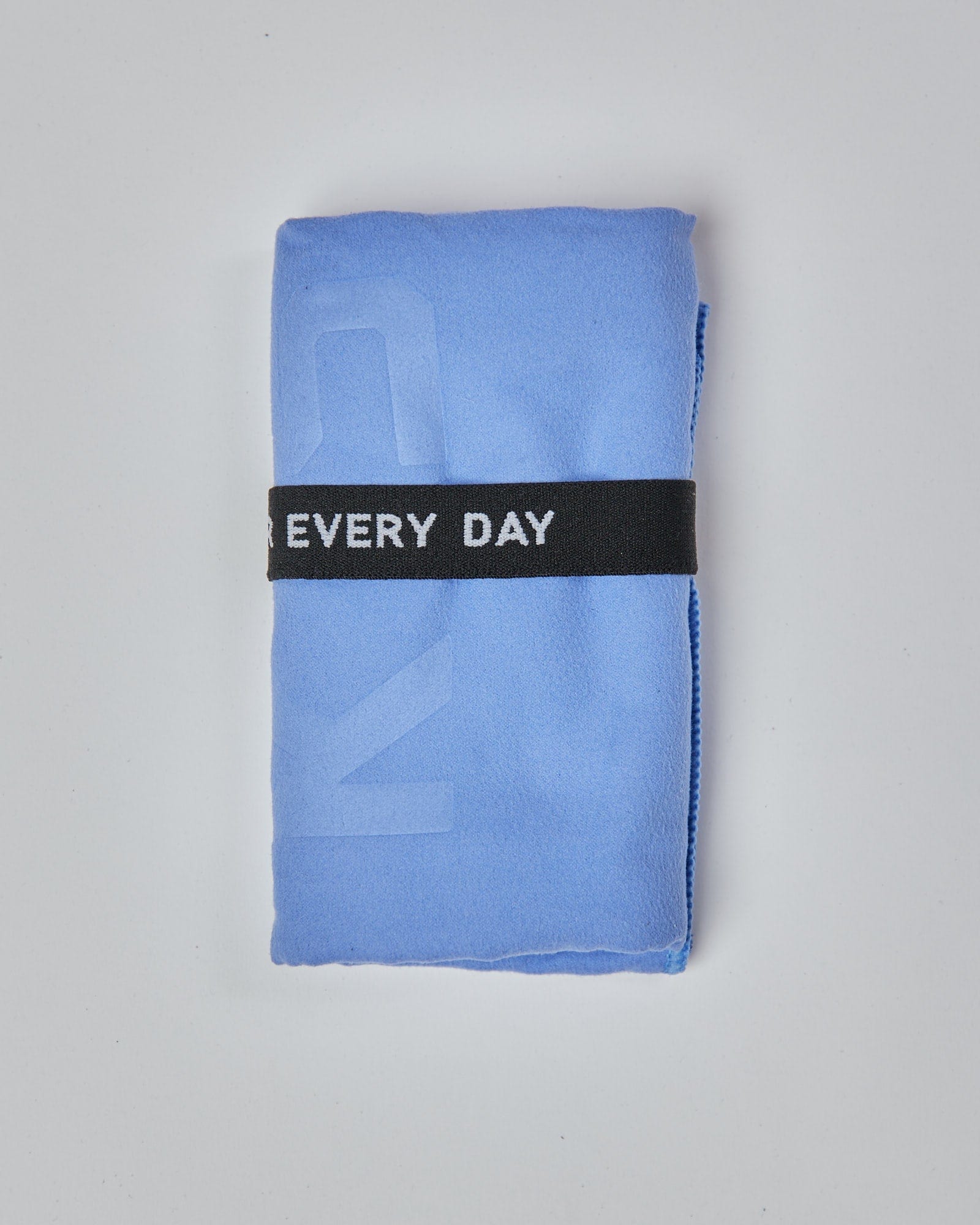 Model wearing Perform Lightweight Microfibre Towel - Cornflower Blue