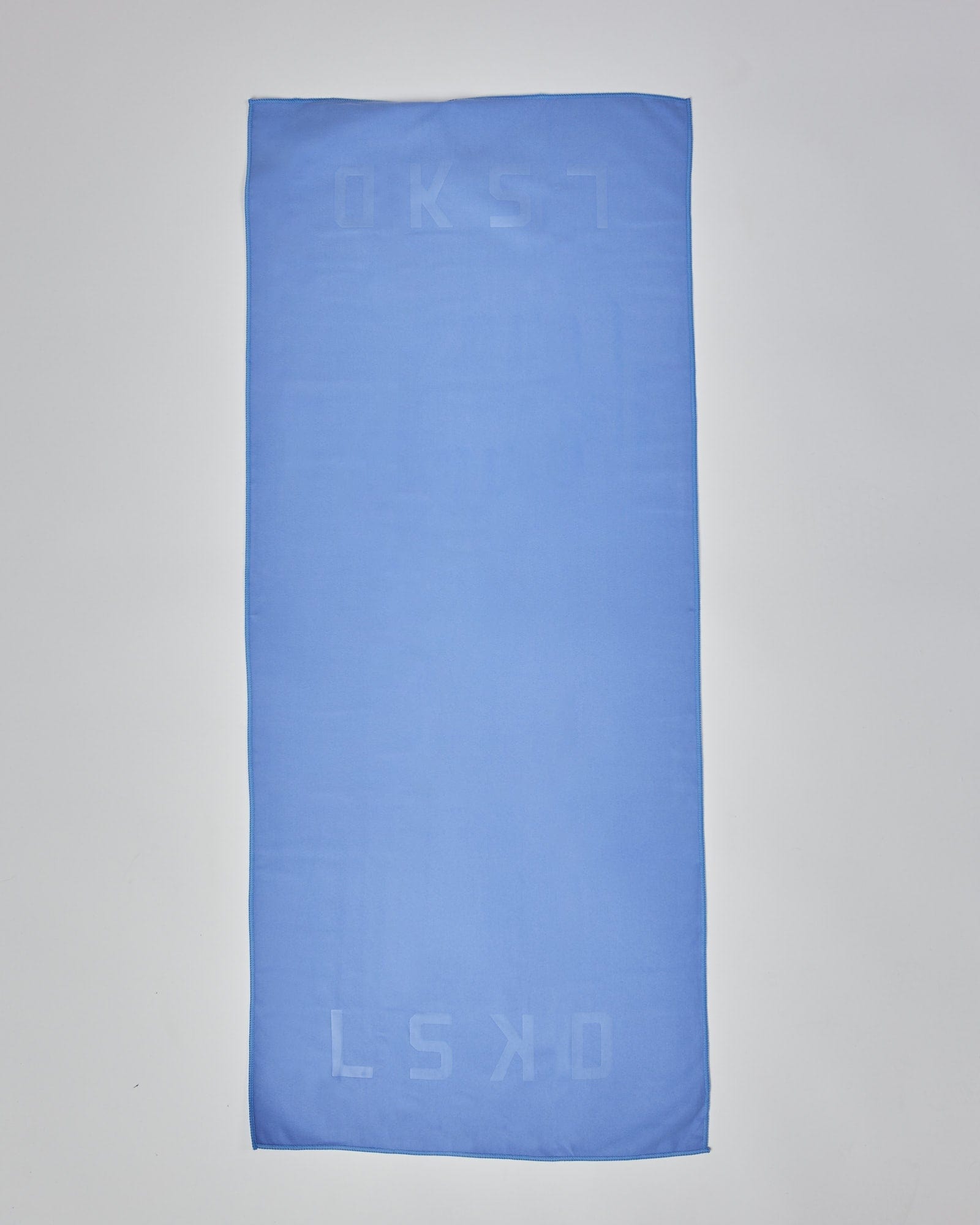 Model wearing Perform Lightweight Microfibre Towel - Cornflower Blue