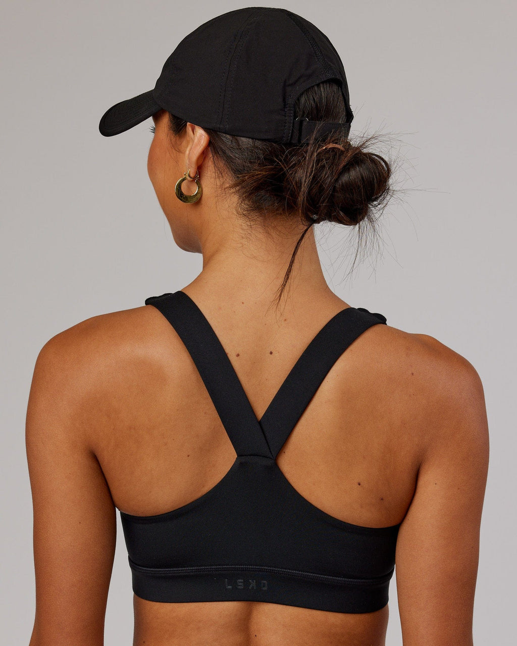 Model wearing Performance Tech Cap - Black