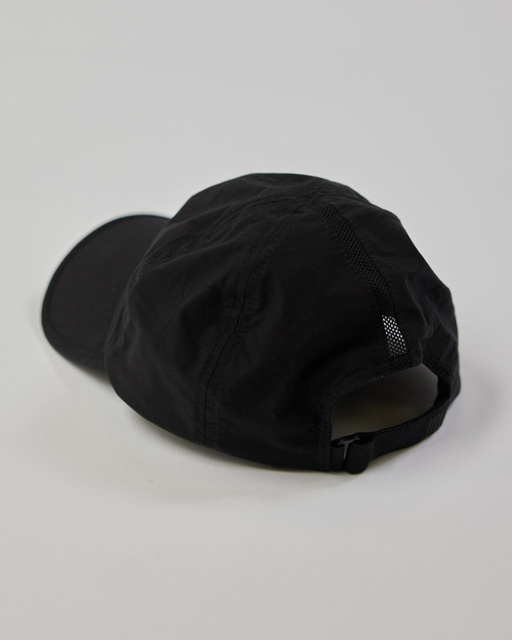 Model wearing Performance Tech Cap - Black