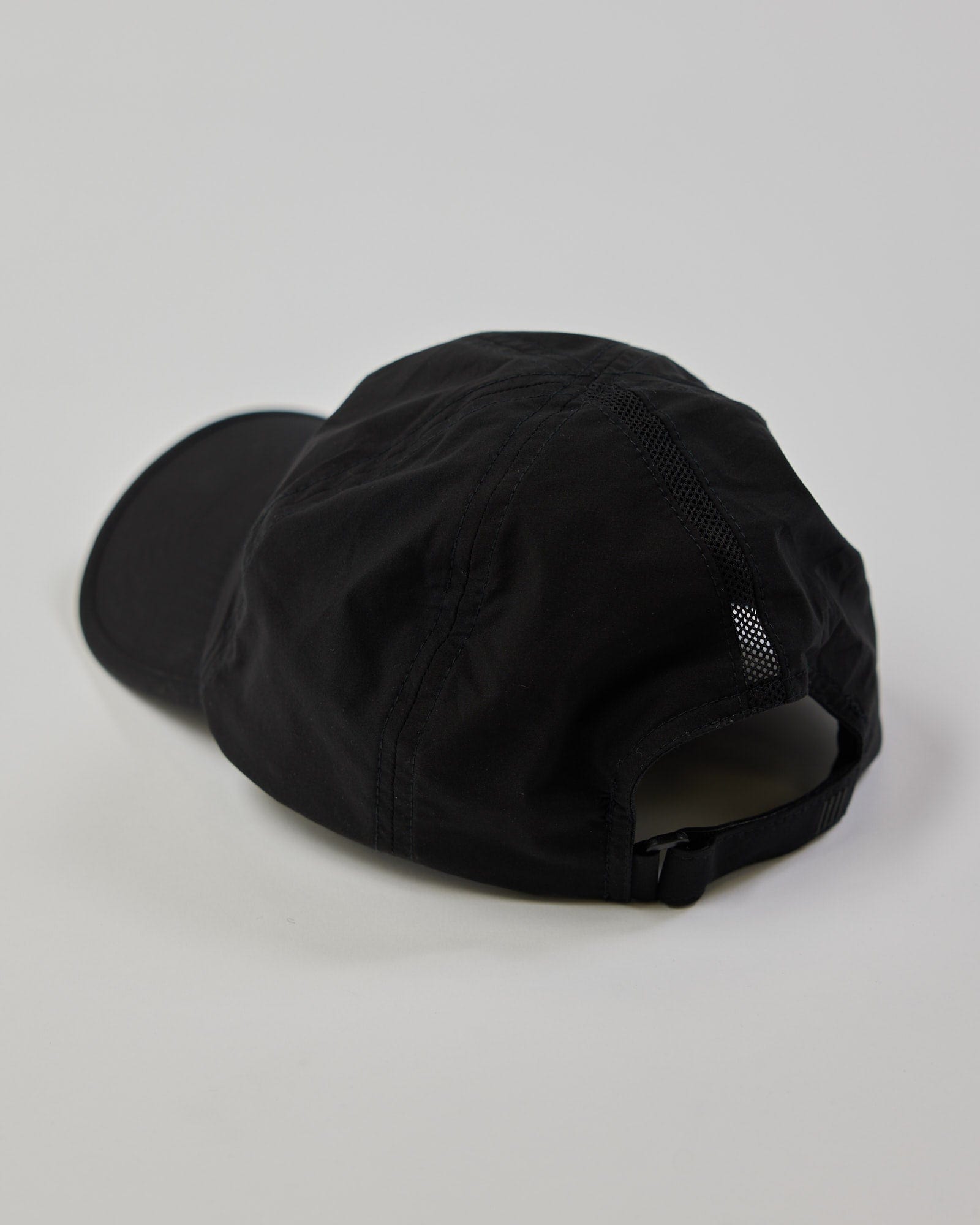 Model wearing Performance Tech Cap - Black