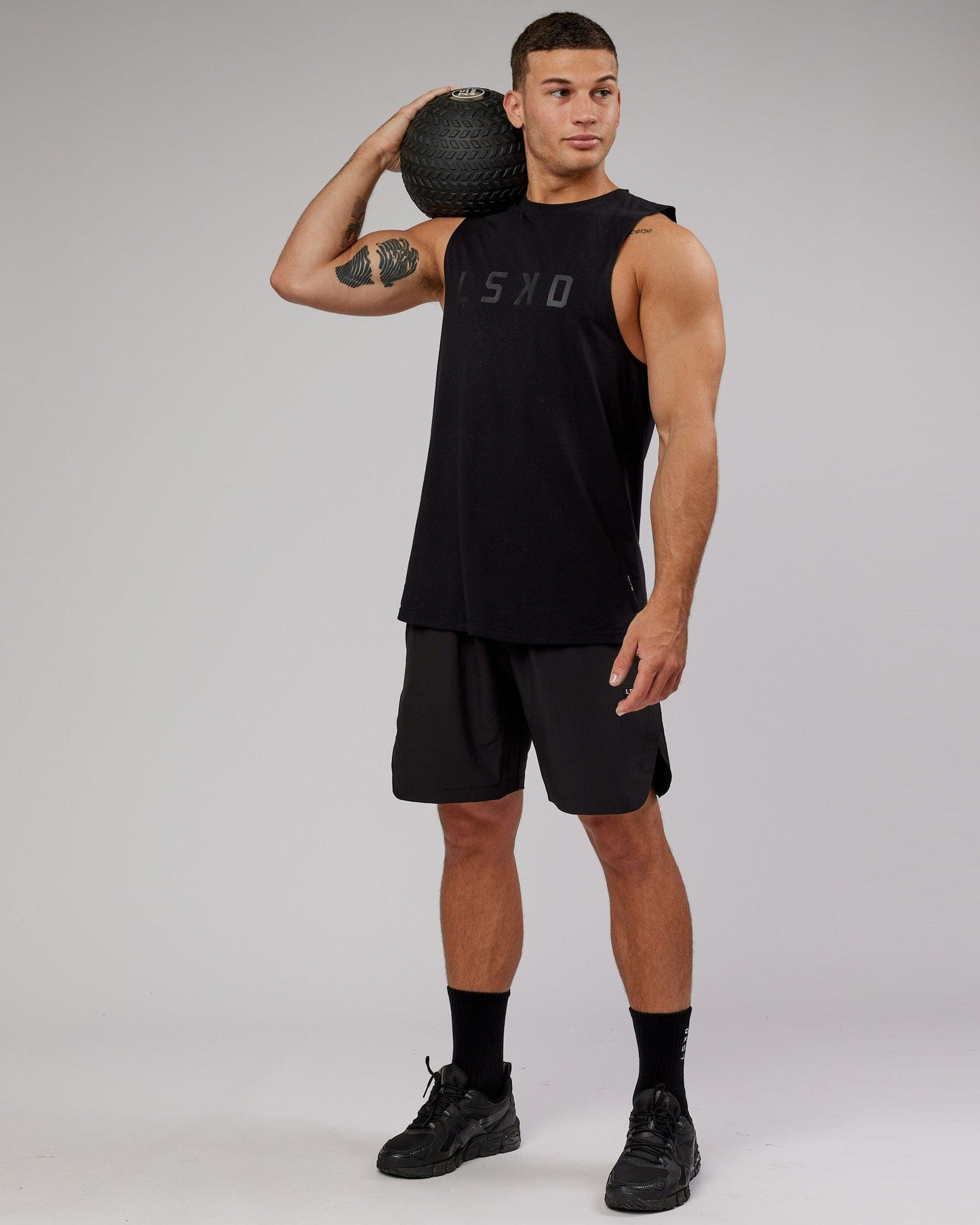 Model wearing Power FLXDRY Training Fit Performance Tank - Black-Black