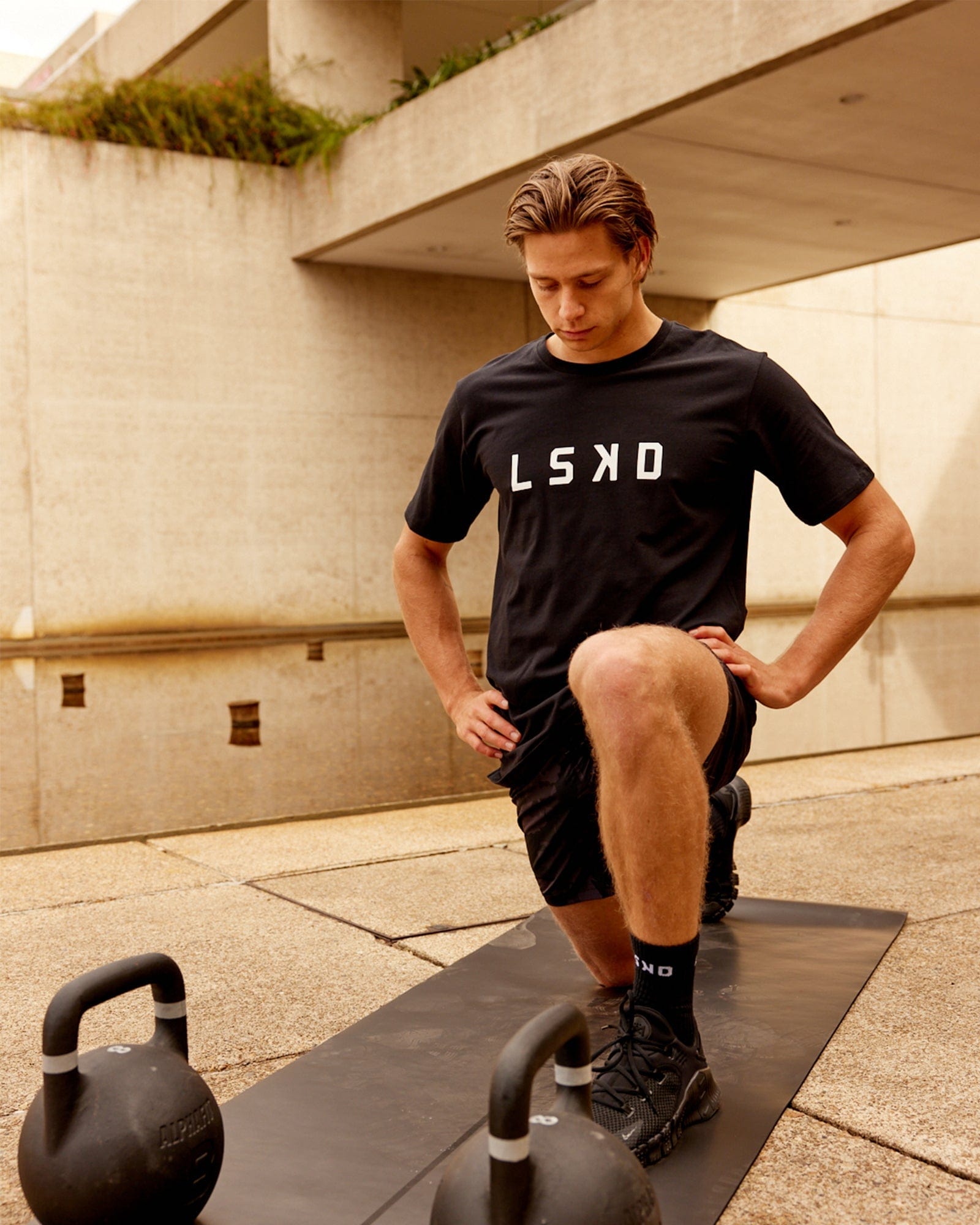 Model wearing Power FLXDRY Performance Tee - Black