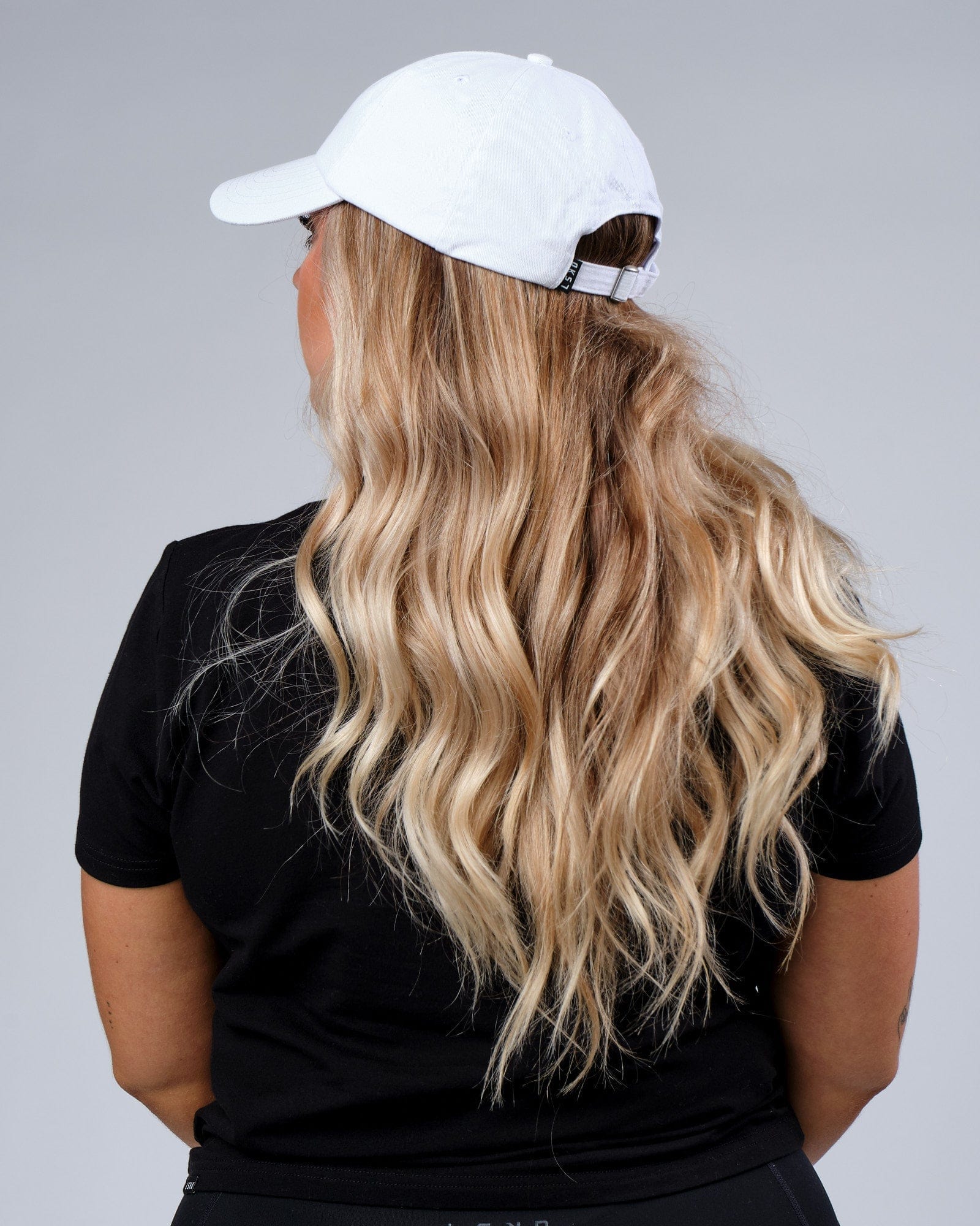 Model wearing Progress Cap - White