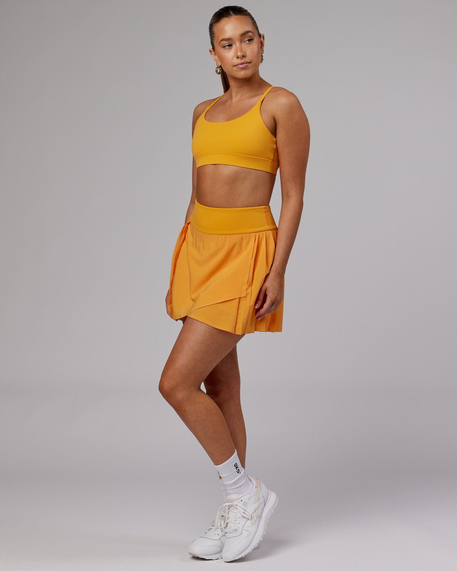Model wearing Rally Tennis Skirt - Butterscotch