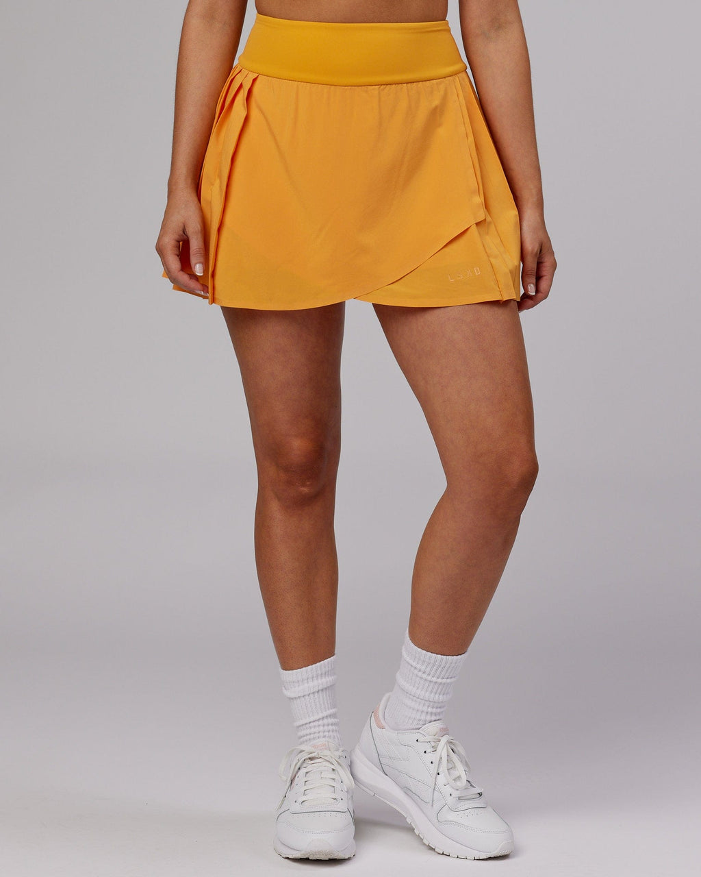 Model wearing Rally Tennis Skirt - Butterscotch