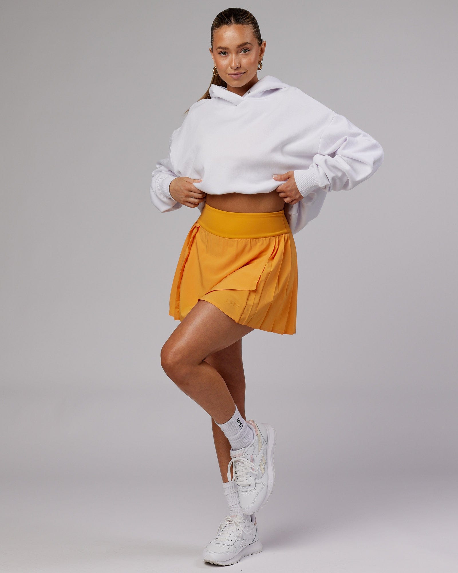 Model wearing Rally Tennis Skirt - Butterscotch