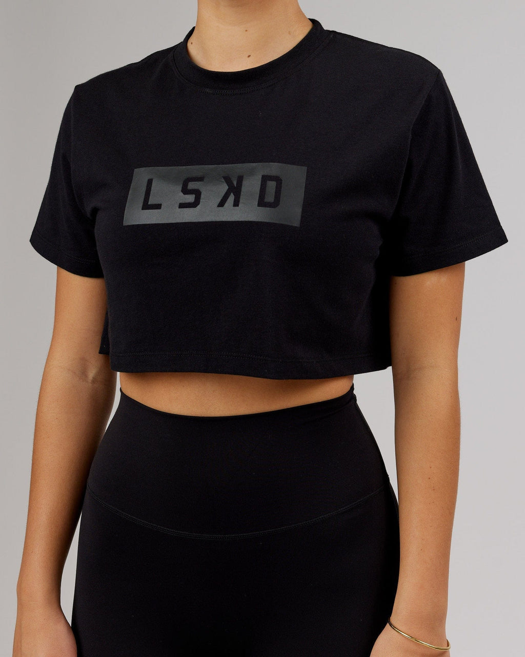 Model wearing Rapid FLXDRY Cropped Tee - Black