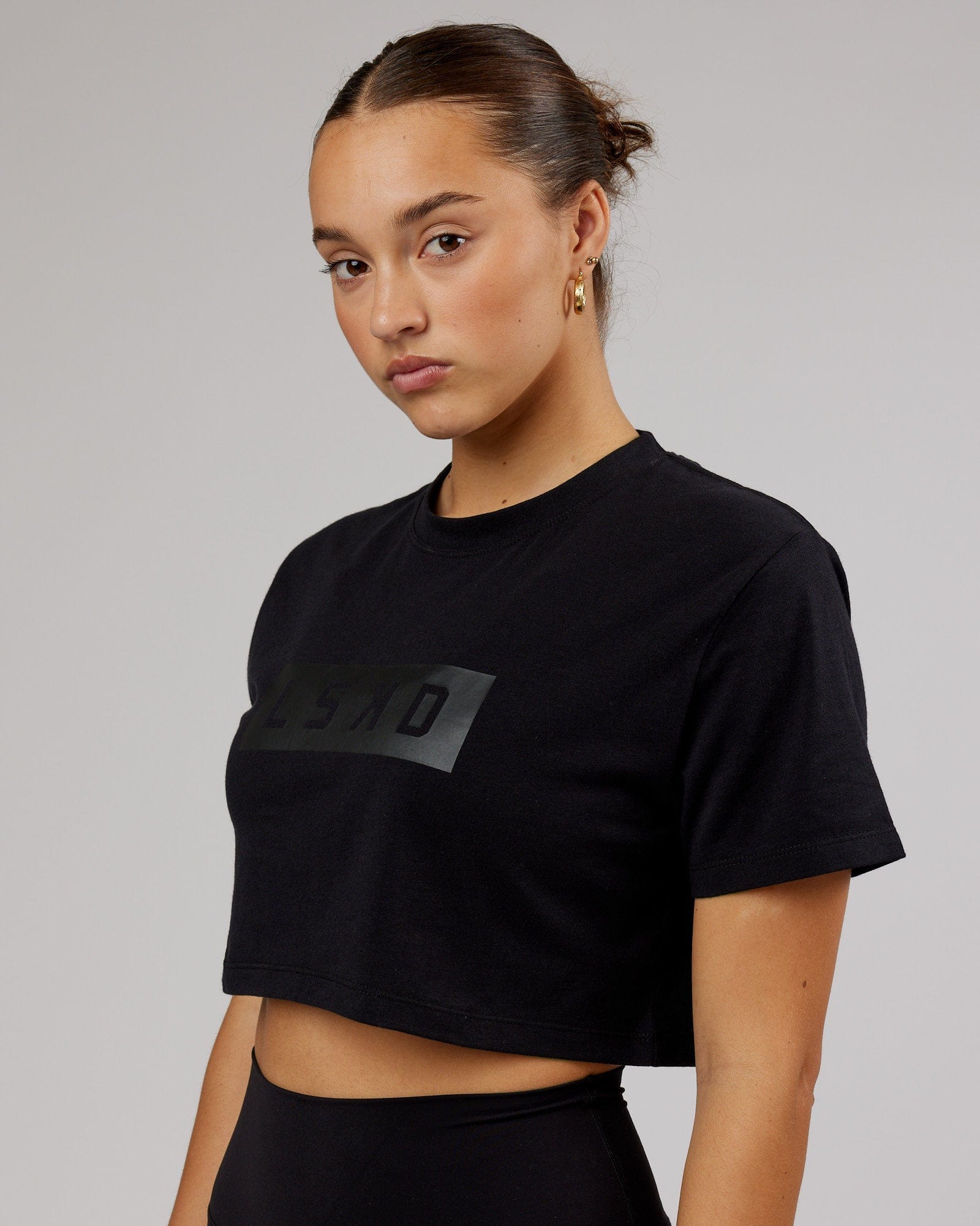 Model wearing Rapid FLXDRY Cropped Tee - Black