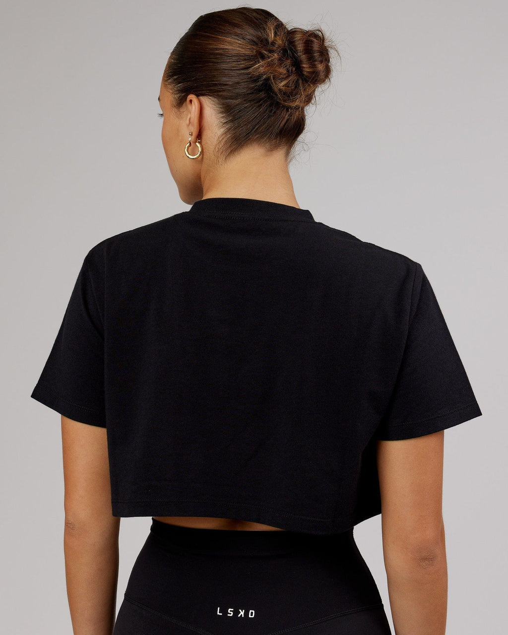 Model wearing Rapid FLXDRY Cropped Tee - Black