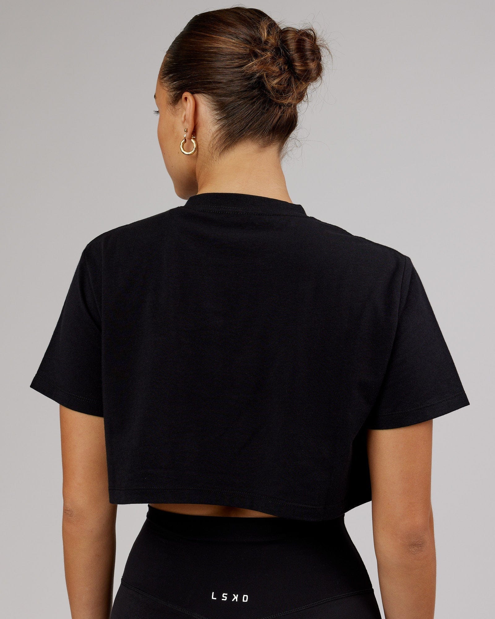 Model wearing Rapid FLXDRY Cropped Tee - Black