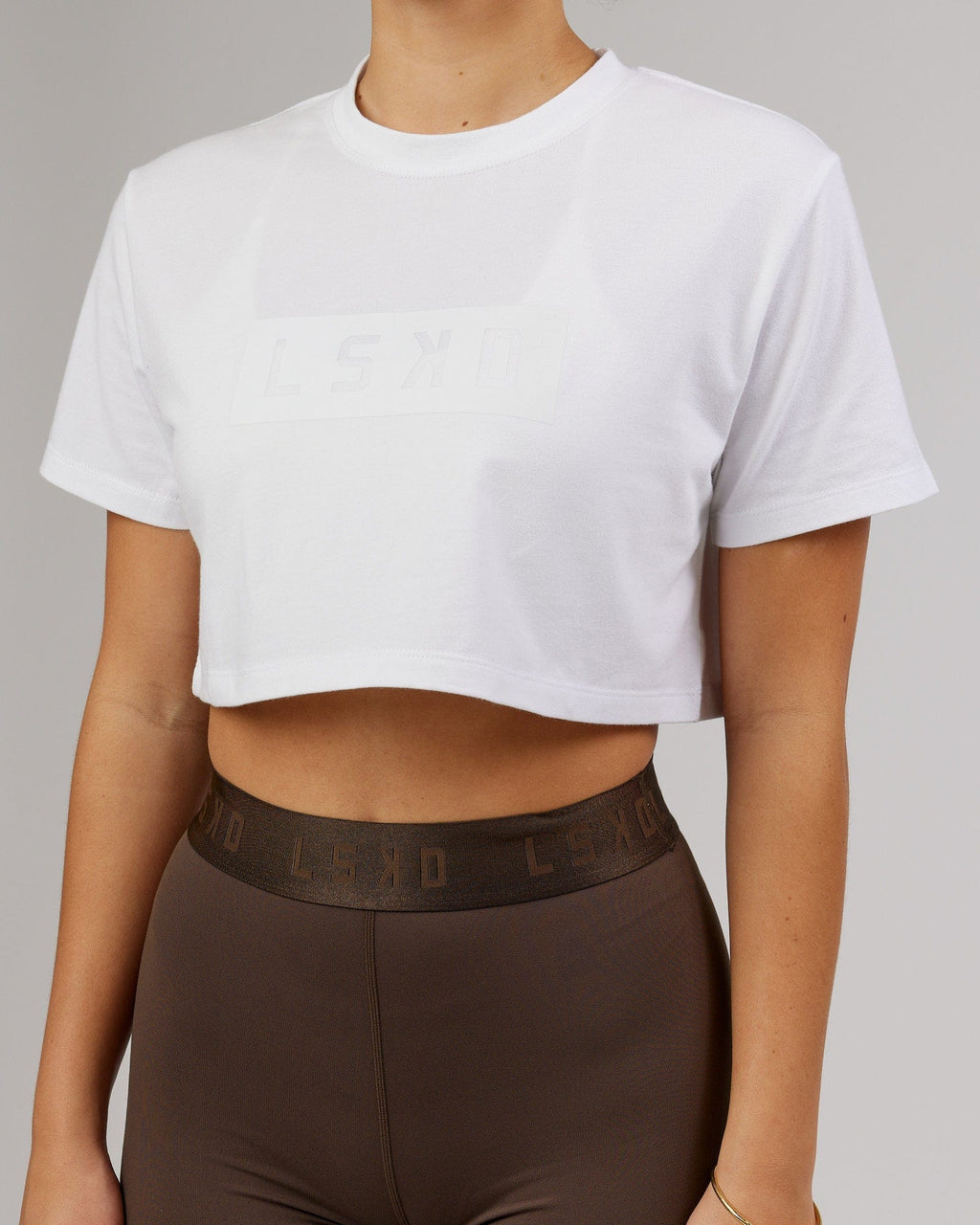 Model wearing Rapid FLXDRY Cropped Tee - White