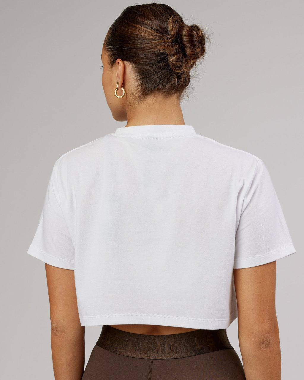 Model wearing Rapid FLXDRY Cropped Tee - White